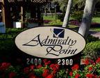 Admiralty Point sign amidst lush greenery